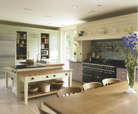  ??  ?? This kitchen mixes both the Cook’s Kitchen (the island) and the New England style from Mark Wilkinson (for the cooker and storage wall), demonstrat­ing that the room doesn’t need to be homogenous in its design. Handmade kitchens start from £40,000...