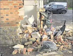  ?? ?? A Peugeot left the road and smashed into the side of the pub on Monday, destroying the toilet