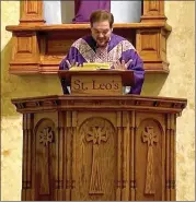  ?? Photo by Brian D. Stockman ?? St. Leo Pastor Father Justin Pino read a letter from the Bishop to the Parish.