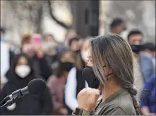  ?? Will Waldron / Times Union ?? Jinah Kim, the owner of Sunhee’s Farm and Kitchen in Troy and a law student, addresses the rally in Albany on Monday. Some local people say they’ve felt heightened fear of facing bias or violence during the pandemic.