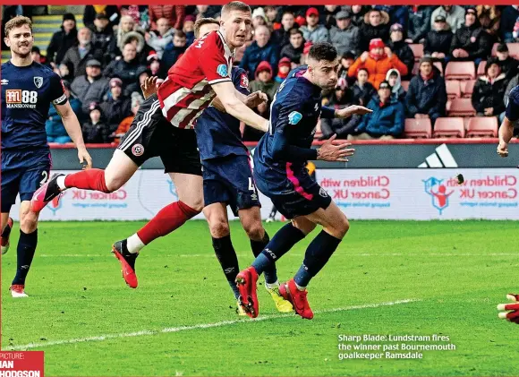  ?? PICTURE: IAN HODGSON ?? Sharp Blade: Lundstram fires the winner past Bournemout­h goalkeeper Ramsdale