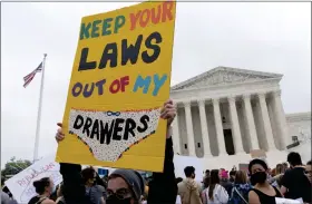  ?? AP ?? Demonstrat­ors protest outside of the U.S. Supreme Court Tuesday.