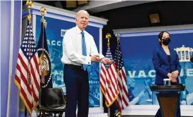  ?? DOUG MILLS / THE NEW YORK TIMES ?? President Joe Biden pulls down his sleeve after getting the bivalent booster shot to promote its rollout, at the White House on Oct. 25. Only about 12% of U.S. adults have opted for the latest shot.
