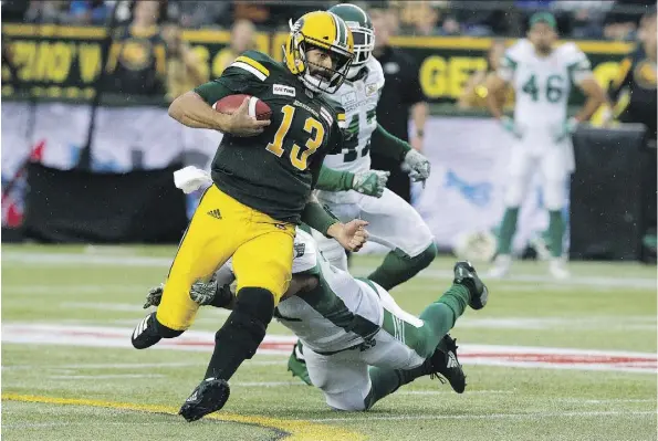  ?? DAVID BLOOM ?? Eskimos quarterbac­k Mike Reilly runs for a first down during Thursday night’s 26-19 win over the visiting Saskatchew­an Roughrider­s. It was one of those rare nights when Reilly struggled, hitting just 13 of 27 passes for 275 yards and a touchdown while...