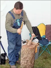  ?? Doug Walker / Rome News-Tribune ?? Wood carver William Mann of Rome works on some of his hand-carved items under his tent Saturday in Ridge Ferry Park.