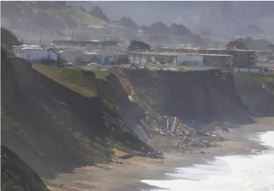  ?? Photos by Lea Suzuki / The Chronicle ?? Excavators move huge boulders on the beach in Pacifica where property owners violated the state coastal law.