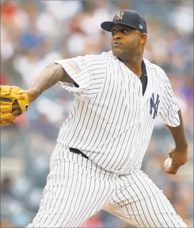  ?? Jim McIsaac / Getty Images ?? Yankees pitcher CC Sabathia delivers against the Braves on Wednesday in New York.