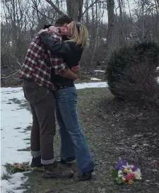  ??  ?? SAD MEMORIES: Madison Hamburg hugs his aunt Conway Beach at the spot where his mother’s body was found, in ‘Murder in Middle Beach.’