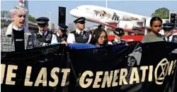  ??  ?? Protest: The climate change group march at Heathrow