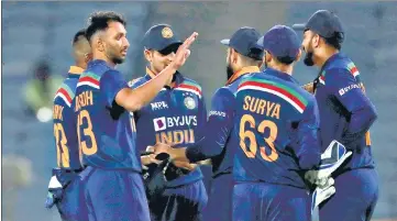  ?? AP ?? Prasidh Krishna (left), who made his India debut on Tuesday, celebrates with the rest of the team after winning the first ODI against England in Pune. Krishna was named the Man-of-the-Moment for his figures of 4/54.