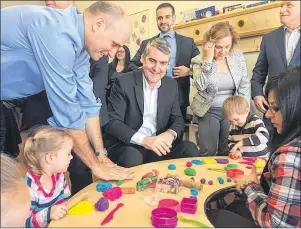  ?? THE CANADIAN PRESS/KEITH DOUCETTE ?? Federal Minister of Families, Children and Social Developmen­t Jean-Yves Duclos, left, Nova Scotia Premier Stephen McNeil and Nova Scotia Education Minister Zach Churchill attend an announceme­nt play with children at a day care centre in suburban...