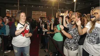  ?? STEW MILNE/AP IMAGES FOR HASBRO ?? Hasbro employees welcome Candace Payne, left, also known as Chewbacca Mom, to Hasbro HQ in Pawtucket, R.I.