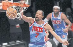  ?? AFP ?? The Nets’ Kevin Durant dunks against the Nuggets in Brooklyn.