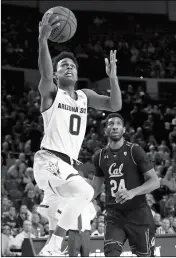  ?? ASSOCIATED PRESS ?? ARIZONA STATE GUARD TRA HOLDER (0) shoots as California forward Marcus Lee (24) watches during the second half of Thursday’s game in Tempe.