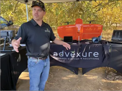  ?? PHOTOS BY JENNIE BLEVINS — ENTERPRISE-RECORD ?? Advexure Vice President of Business Developmen­t Cody Thomas talks about his company’s drones Wednesday at Precision Ag Day at the Chico State University Farm in Chico.