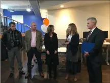  ?? PHOTO PROVIDED BY RENSSELAER COUNTY ?? President of the Rensselaer County Regional Chamber of Commerce Kate Manley, second from right, presents Passport for Good with a “Good News Award.”