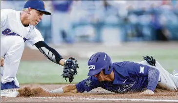  ?? REBECCA S. GRATZ / OMAHA WORLD-HERALD ?? TCU’s Nolan Brown (right) is picked off at first base by Florida’s JJ Schwarz during the fourth inning of their College World Series game. TCU lost 3-0 to fall into the loser’s bracket in Omaha, Neb.