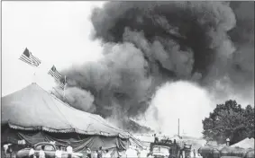  ?? AP PHOTO/FILE ?? In this July 6, 1944, photo, people flee a fire in the big top of the Ringling Bros. and Barnum & Bailey Circus in Hartford.