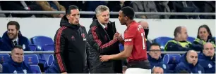  ?? Reuters ?? Manchester United interim manager Ole Gunnar Solskjaer (centre) having scored 126 goals in 11 seasons as a player. — is a favourite of the United faithful