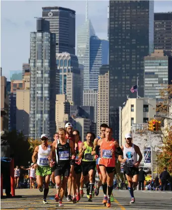  ?? Getty ?? Runners at last year’s New York Marathon; its organisers say Sunday’s event will go ahead