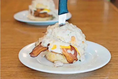  ?? [PHOTO PROVIDED BY DEBORAH COGAN] ?? Spoons’ “The Beast” is a fried chicken breast, fried egg, bacon and cheese sandwiched between a buttermilk biscuit then topped with country sausage gravy.