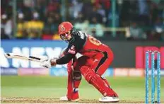  ??  ?? AB De Villiers (left) and Quinton de Kock (centre) put the Chennai Super Kings bowling to sword in the Indian Premier League match at Chinnaswam­y Stadium in Bengaluru yesterday. De Villiers hit a quickfire 68 off 30 balls while de Kock scored 53 off 37...