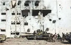  ?? AP ?? Tanks amid destroyed buildings in Sirte, Libya. Lack of strong border controls has allowed militia fighting the Sudanese and Chadian government­s to set up camp inside Libya.