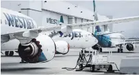  ?? JEFF MCINTOSH THE CANADIAN PRESS FILE PHOTO ?? The WestJet Boeing 737 Max aircraft are eligible to return to Canuck skies, after two years of government study.