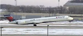  ?? RICK WOOD / MILWAUKEE JOURNAL SENTINEL ?? Delta Air Lines has joined others in testing biometric screening with a pilot fingerprin­t program at Reagan Washington National Airport. Such screenings are extremely accurate, experts say.