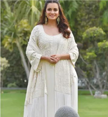  ??  ?? Actress Dia Mirza poses for photograph­ers before attending a panel discussion “Beat Plastic Pollution” on the occasion of World Environmen­t Day 2018, in New Delhi