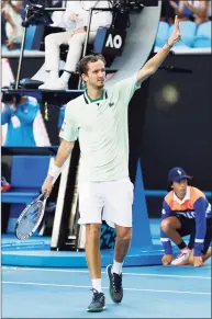  ?? Darrian Traynor / Getty Images ?? Daniil Medvedev celebrates match point in his third round singles match against Botic van de Zandschulp at the Australian Open on Saturday.