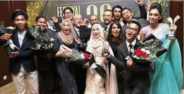  ??  ?? Wrap party: The cast and crew receiving the award at Putra World Trade Centre.