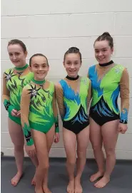  ??  ?? DyNamo’s Grade 2 Team at the National Series with their National Series Medals. DyNamo’s Grade 4 Gymnasts ready to perform.