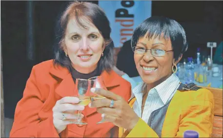 ?? PHOTOGRAPH­S: FREDLIN ADRIAAN ?? A WEE DRAM: Erica Baldwin (left) and Mary-Anne Nhlapo raise a glass at the Three Ships Whisky tasting