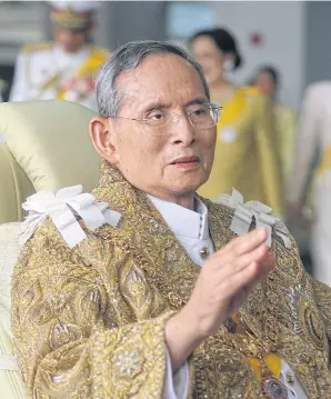  ??  ?? The late King Bhumibol Adulyadej waves to people during a royal function. Royal merit-making ceremonies will be held today and tomorrow to mark one year since the passing of the late King. His Majesty the King, his son, will preside over the ceremonies.