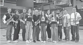  ?? DIANA HAHN ?? Former Scottsburg High School pep band members are stepping in for state. From left: Dylan Best, junior; Noah Phillips, senior; Garrett Densford, junior; Lillie Broadus, sophomore; Judge Jason Mount (Class of 1989); Scarlett Herald, sophomore; Kelsea Hall (2014); Skylar Herald; Mickey Hall (2015); Zach Bane (1998); and Troy Alexander (1991).