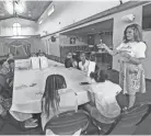  ?? ANGELA PETERSON / MILWAUKEE JOURNAL SENTINEL ?? Rahshenia Patrick talks to girls about the benefits of proper dental habits while holding a health and wellness workshop.