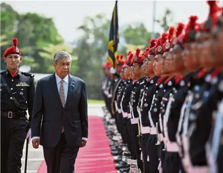  ??  ?? Honoured: Dr Ahmad Zahid inspecting a guard-of-honour at the official launching ceremony of the Royal Malaysian Air Force Peninsular Malaysia Base in Subang.