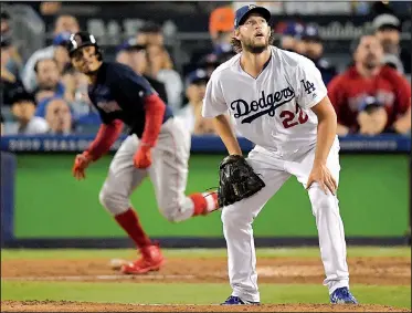  ?? AP/MARK J. TERRILL ?? Mookie Betts (left) of the Boston Red Sox watches his home run off Los Angeles Dodgers starter Clayton Kershaw during the sixth inning in Game 5 of the World Series on Sunday in Los Angeles. Half the 44 runs scored by the Dodgers and the champion Red Sox came across the plate on home runs.