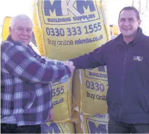  ??  ?? Photograph shows from left to right – Mike McNamara (left), Manager of Trade Skills and MKM building supplies Macclesfie­ld branch Director Peter Gibson