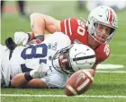  ?? JOSHUA A. BICKEL/COLUMBUS DISPATCH ?? Ohio State LB Pete Werner (20), seen breaking up a pass against Penn State last year, will try to be a run-stopper on the strong side this year.