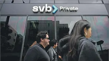  ?? Patrick T. Fallon AFP / Getty Images ?? THE FED’S rate hikes have led to a banking crisis triggered by Silicon Valley Bank’s failure and subsequent runs on other banks in the U.S. and overseas. Above, an SVB Private branch in Santa Monica this month.