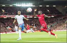  ?? ?? Liverpool’s Sadio Mane (right), vies for the ball with Manchester United’s Aaron Wan-Bissaka during the English Premier League soccer match between Liverpool and Manchester United at Anfield stadium in Liverpool, England. (AP)