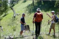  ?? Submitted photo ?? Gordon Fitzpatric­k, left, enjoyed seeing the old flumes during the recent Tea at the Summit celebratio­n. He outlined the history of the Greata Ranch at the point where the old flumes cross the Fur Brigade Trail.