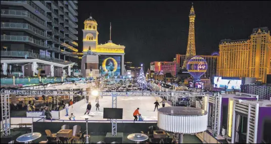  ?? L.E. Baskow Las Vegas Review-Journal @Left_Eye_Images ?? The Cosmopolit­an of Las Vegas has again transforme­d its Boulevard Pool into an ice skating rink for the holiday season.