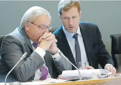  ?? BRUNO FAHY / AFP / GETTY IMAGES ?? Paul Magnette, right, prime minister of the Belgian region of Wallonia, speaks with parliament­ary chairman Andre Antoine, Friday. Magnette said he was open to further talks on CETA, but needed time to review the file.