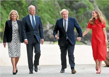  ?? AP ?? Britain’s Prime Minister Boris Johnson, his wife Carrie Johnson and US President Joe Biden with Dr Jill Biden walk outside Carbis Bay Hotel, Cornwall, Britain, ahead of the G7 summit.