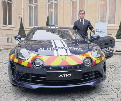  ?? AFP ?? France’s Interior Minister Gerald Darmanin poses next to one of the 16 newly acquired Alpine 110 on their delivery date by French carmaker Alpine (subsidiary of Renault SA) for the French Gendarmeri­e rapid interventi­on unit at the Interior Ministry in Paris yesterday.