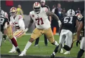  ?? RICK SCUTERI — THE ASSOCIATED PRESS ?? San Francisco 49ers offensive tackle Trent Williams (71) blocks against the Las Vegas Raiders during the first half Sunday, Jan. 1, in Las Vegas.