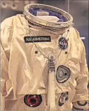  ??  ?? The suit that Armstrong wore aboard Gemini 8 is displayed at the museum.